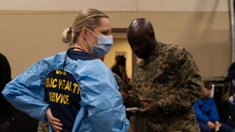 U.S. Public Health Service Lt. Cmdr. Cindy Pallack, left, a dental hygienist and U.S. Navy Reserve Hospital Corpsman 1 Claude Messan, right, a dental technician gather to provide high-quality no-cost dental care during Arctic Care 2024, in Kodiak, Alaska, May 16, 2024. Personnel from across the U.S. Uniformed Services joined Kodiak Arctic Care under the Innovative Readiness Training program, which partnered with the Kodiak Area Native Association to deliver no-cost medical, dental, optometry, and veterinary services to the community across geographically dispersed care sites on Alaska’s remote Kodiak Island. (U.S. Air National Guard photo by Senior Airman Guadalupe Beltran)